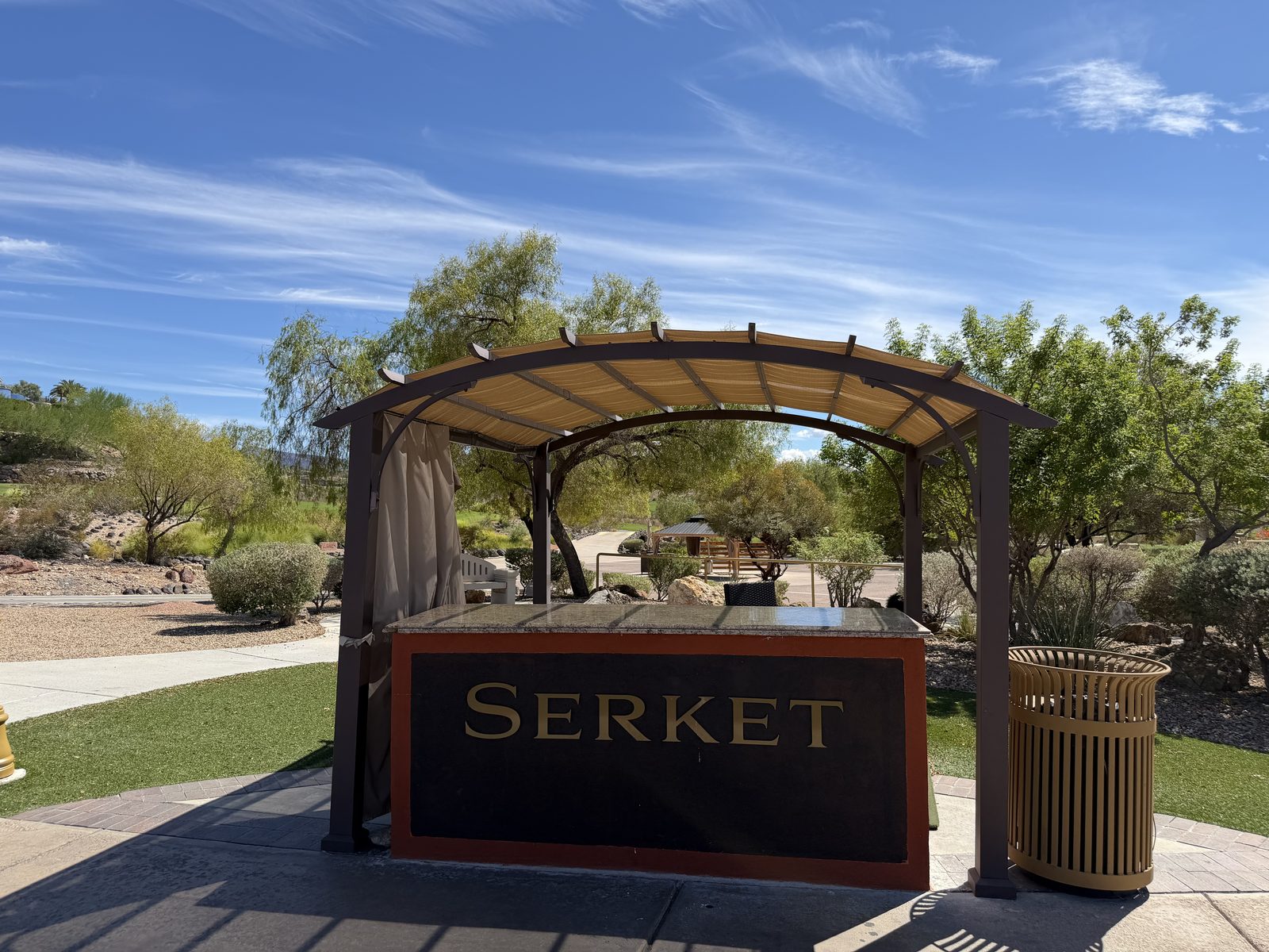 A shaded pavilion and picnic area at a small park beside the Serket entrance in Anthem, Henderson