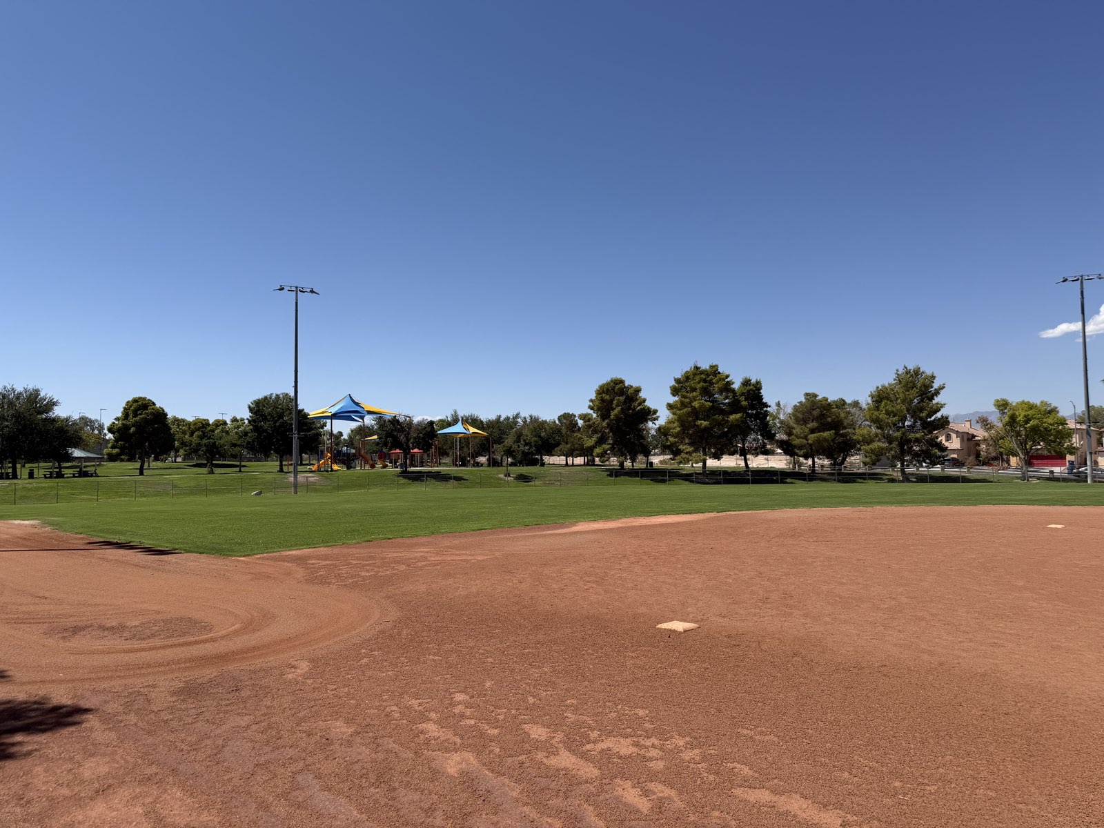 A lit baseball diamond and outfield at Desert Bloom Park, a Clark County park in Southeast Las Vegas