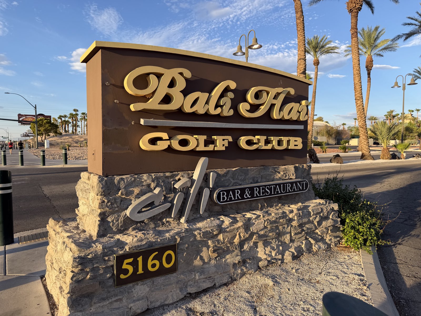 The entrance sign for Bali Hai Golf Club on Las Vegas Boulevard, backed by palm trees