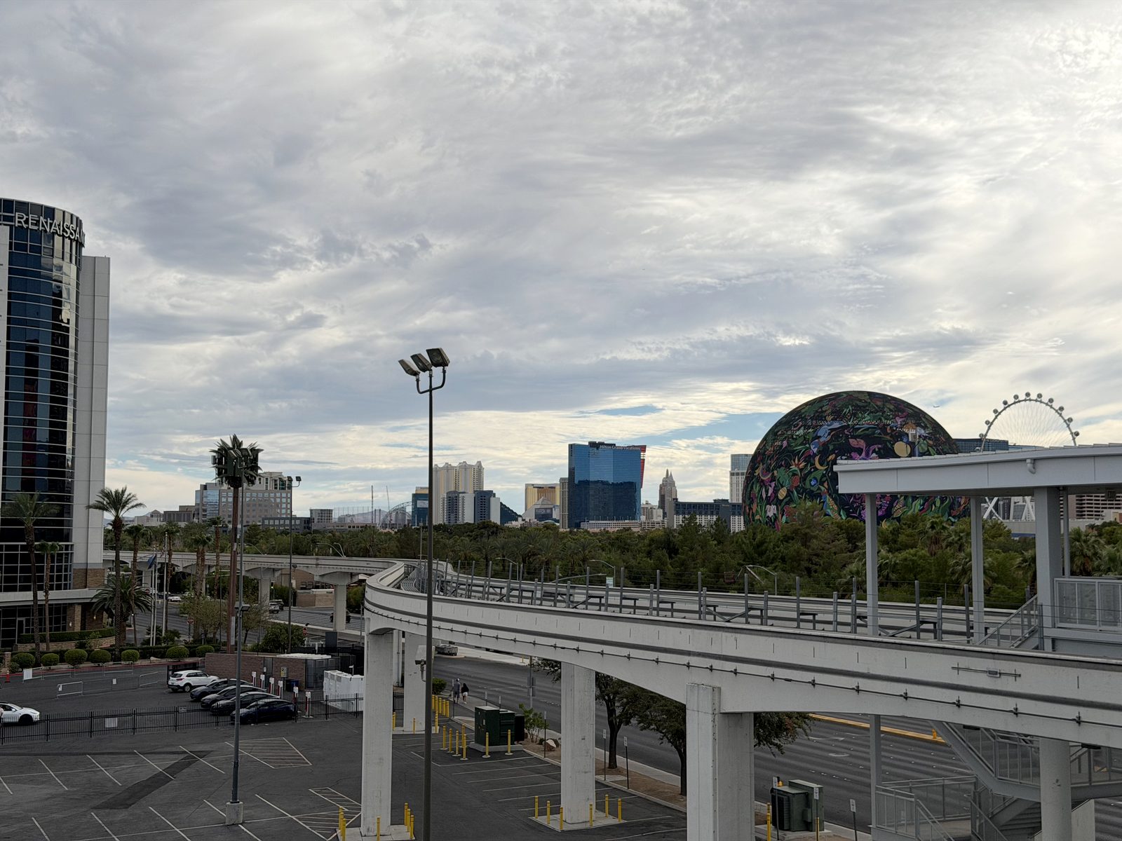The Las Vegas Monorail guideway curving past the convention center station, with the Sphere and the High Roller observation wheel on the skyline