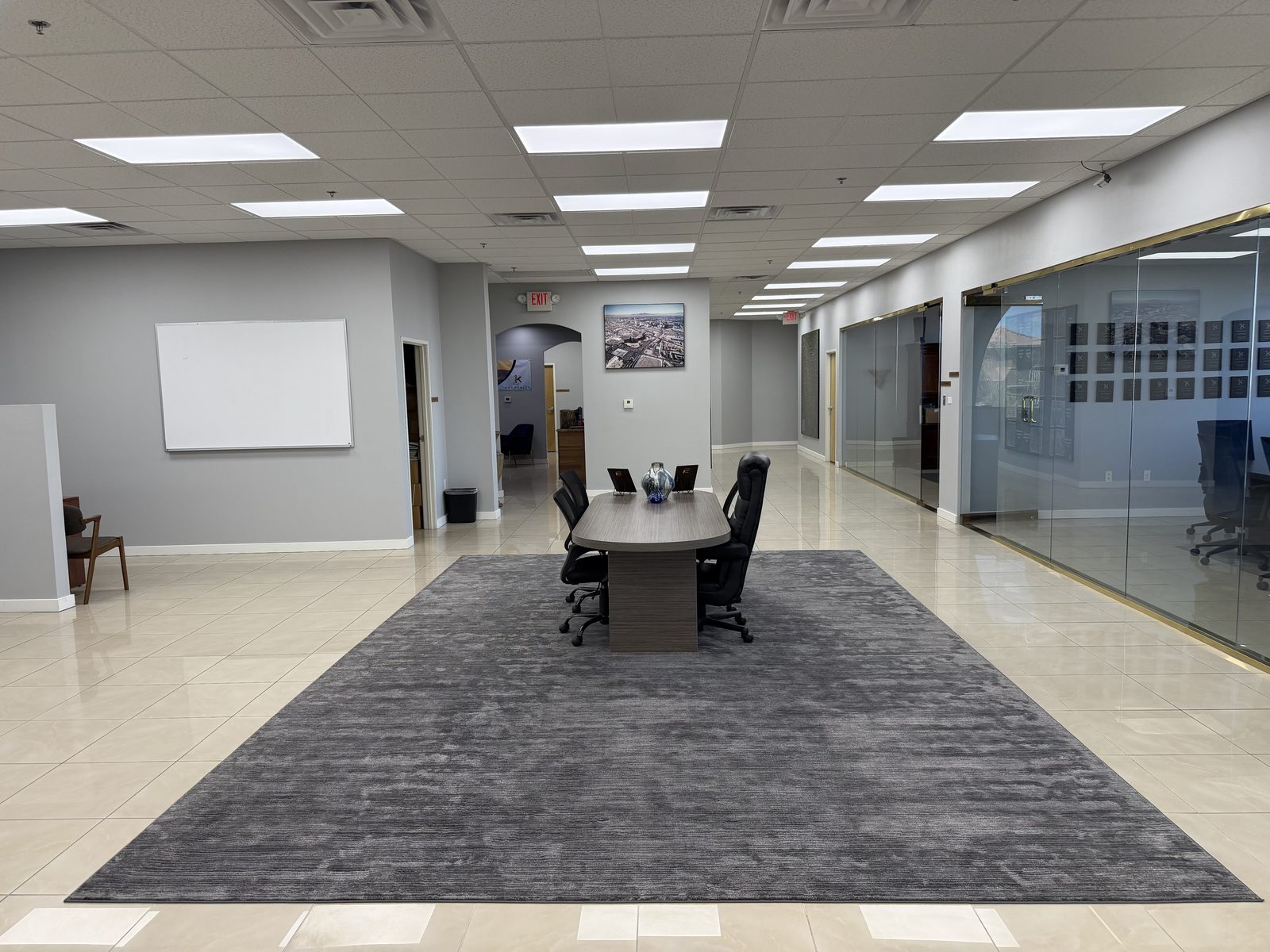 The interior of the Vegas VIP Me office suite in Southeast Las Vegas, looking down the corridor past glass-walled offices