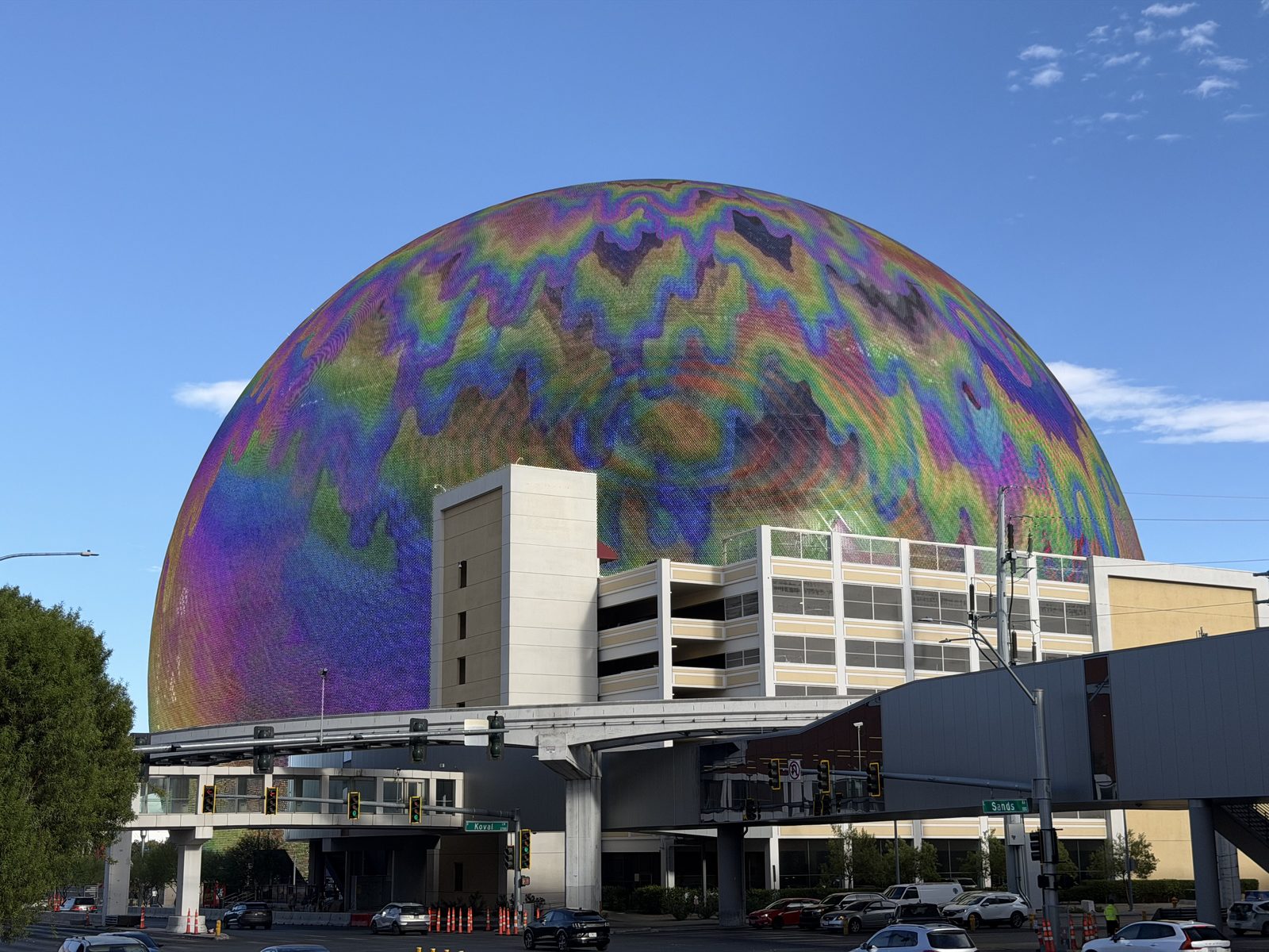 The Sphere in Las Vegas by day showing an iridescent pearl-toned exterior display