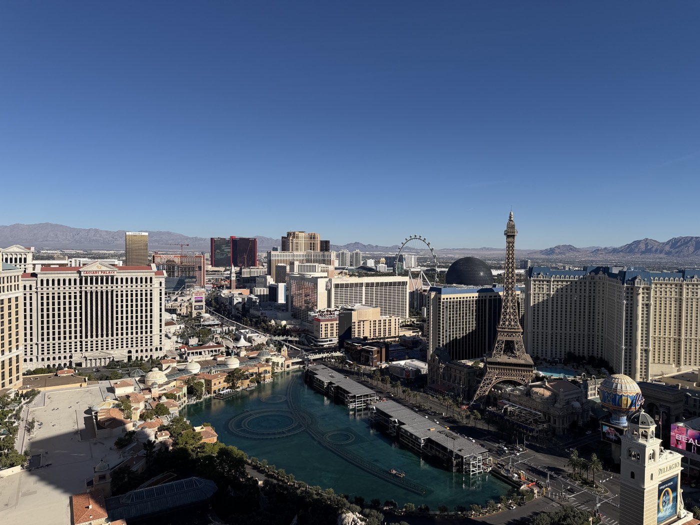 The Las Vegas Strip skyline overlooking the Bellagio lake by day