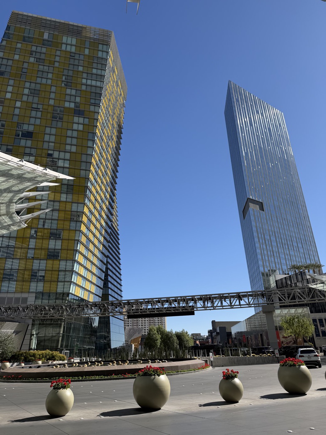 Residential high-rise towers on the Las Vegas Strip against a clear blue sky