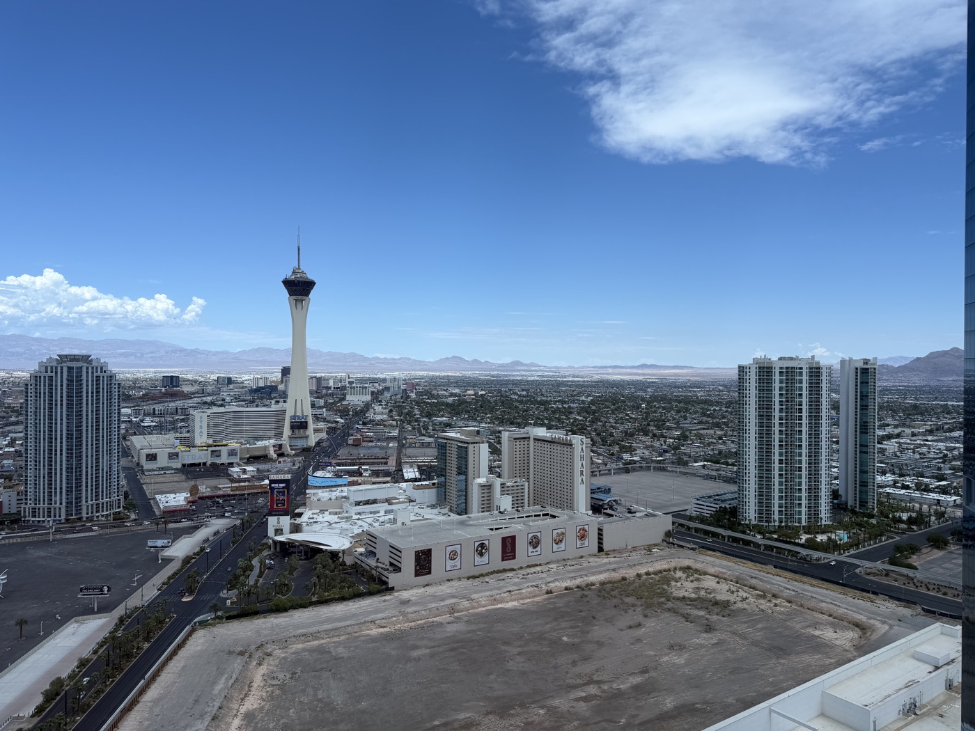 The Strat and high-rise towers above the Las Vegas valley, with mountains beyond
